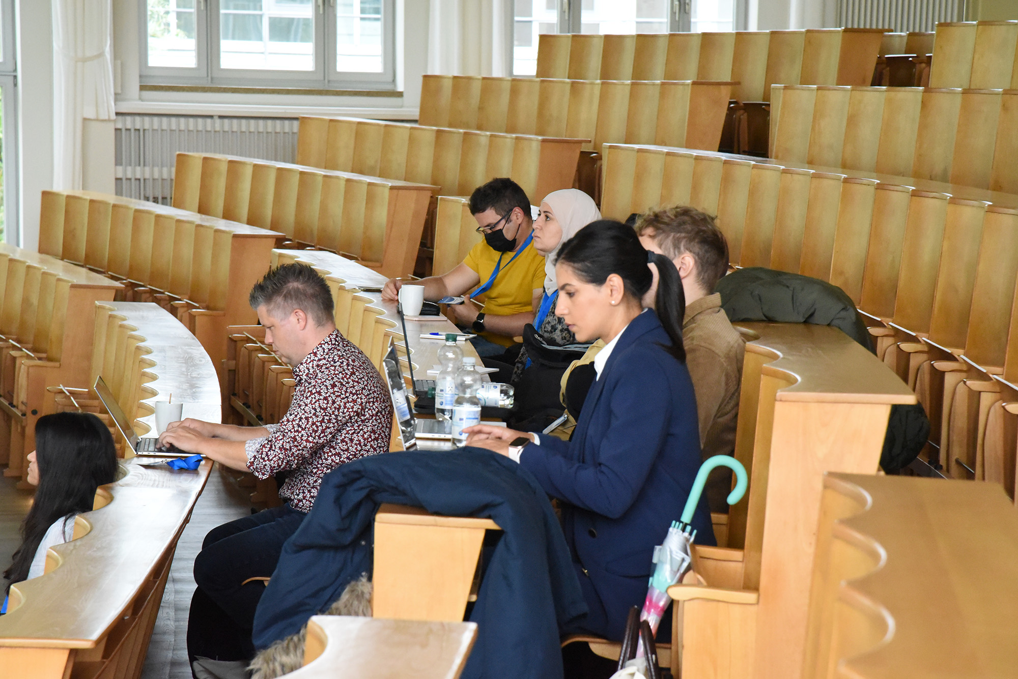 Participants attending technical sessions at the European Wireless conference on wireless communications and networking.